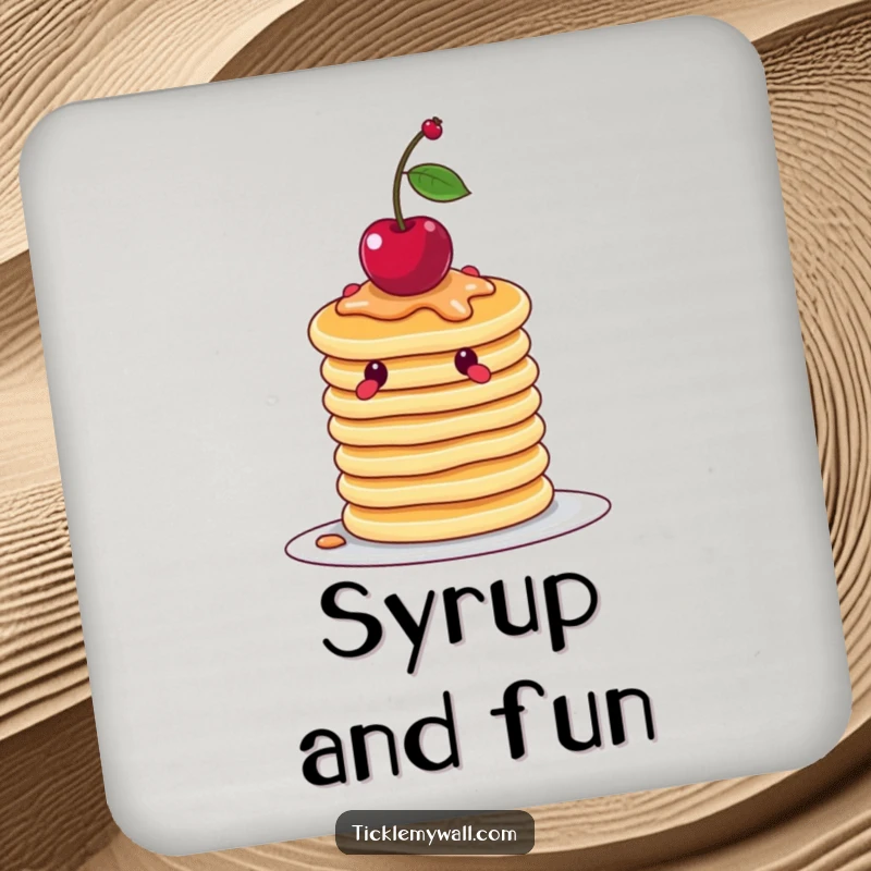 Funny wobbly stack of pancakes attempting to balance a cherry, on a decorative and humorous drink coaster.