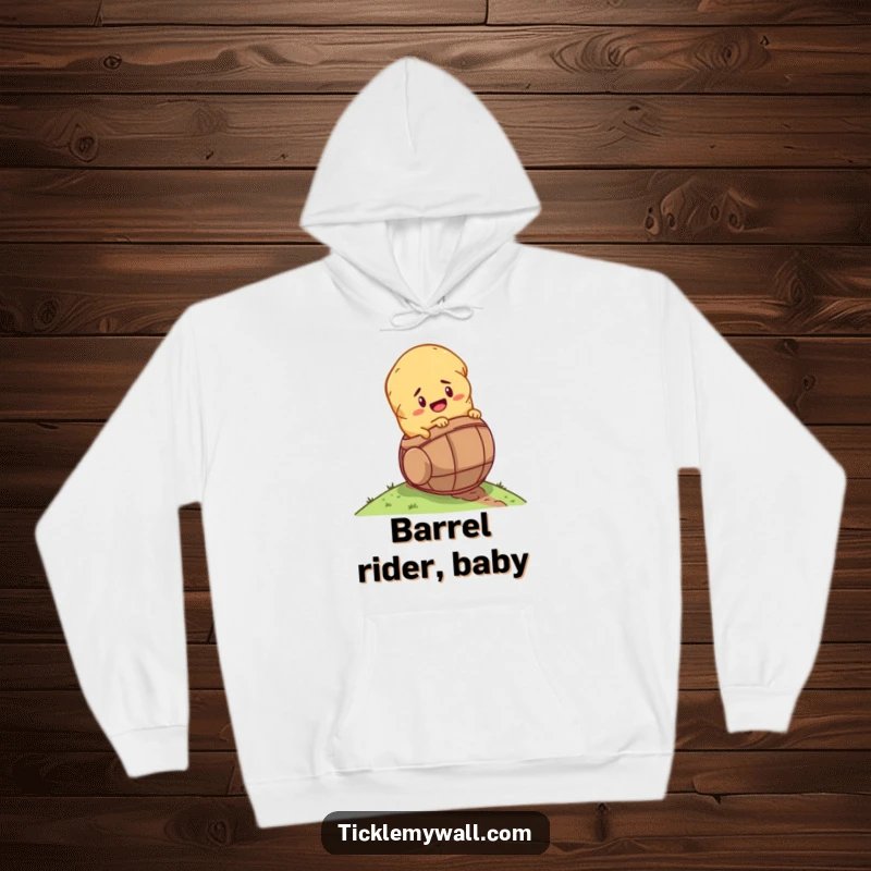 Funny determined potato rolling down a hill inside a tiny barrel on a cozy hoodie, for humorous warmth.