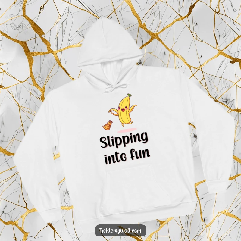 Funny banana peel hoodie depicting an ecstatic peel dancing with a broom, designed for warmth and humorous expression.