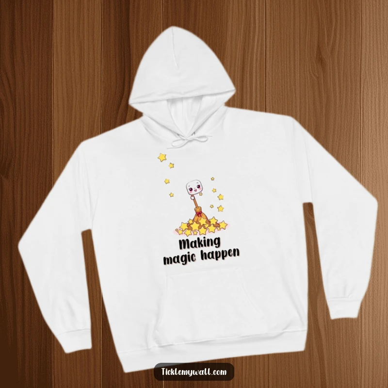 Funny hoodie showing a cheerful broom sweeping up a pile of giggling stars, ideal for cozy, magical, and humorous wear.