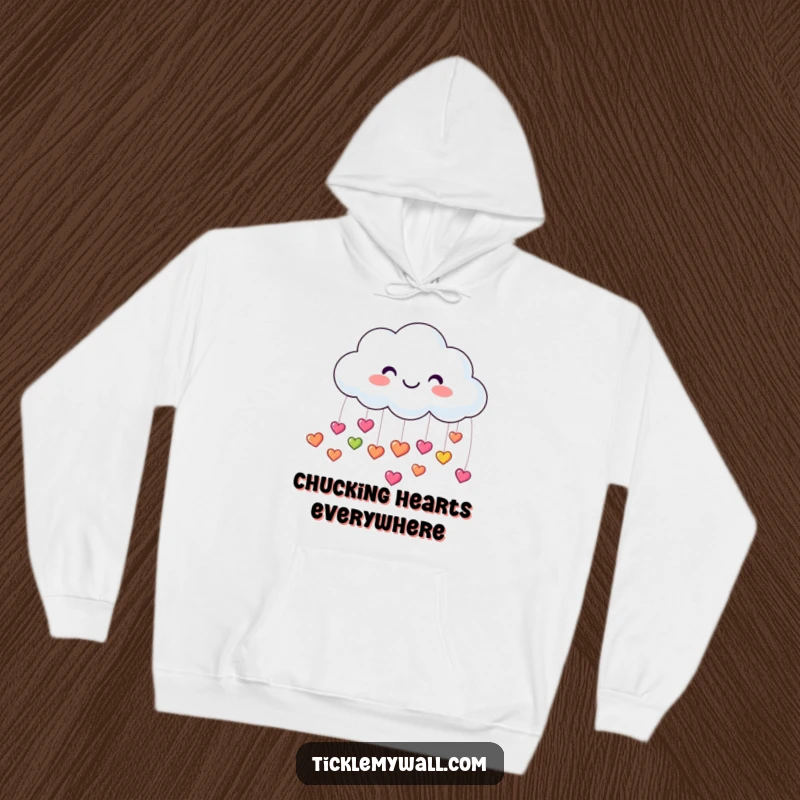 Funny hoodie with a joyful cloud raining tiny, colorful, bouncy heart shapes, offering warmth and a dose of happiness.