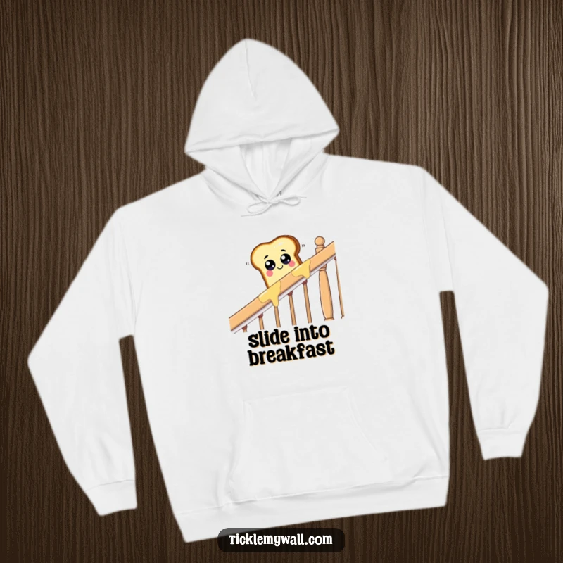 Funny piece of toast with googly eyes sliding down a buttered banister, a comfortable and humorous hoodie.