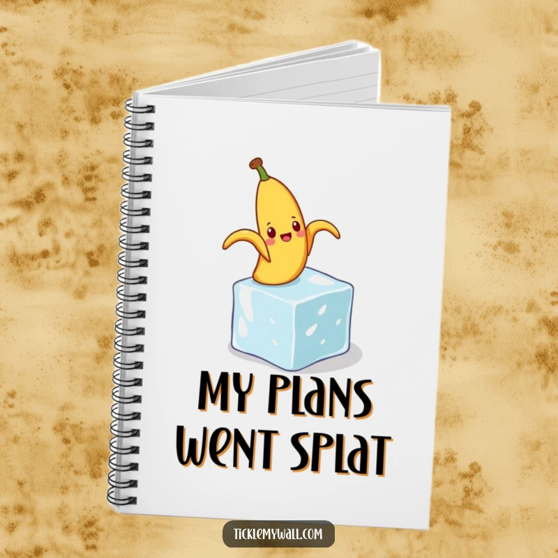 Funny notebook cover with a banana peel comically slipping on a tiny ice cube, ideal for jotting down humorous thoughts.