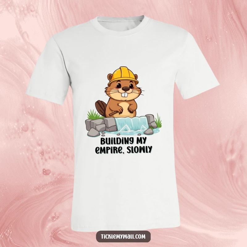 Funny T-shirt graphic of a beaver wearing a hard hat, struggling to build a lopsided dam, looking goofy.