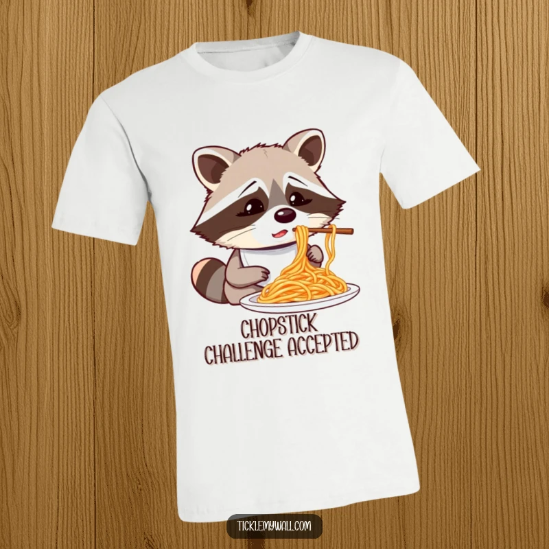 Funny confused raccoon wearing a bib trying to eat spaghetti with chopsticks, a humorous and quirky t-shirt.