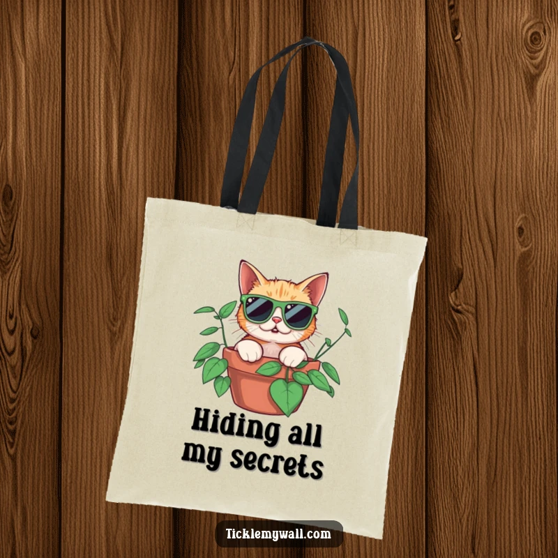 Funny surprised cat wearing oversized sunglasses peeking from a potted plant, on a durable tote bag, ideal for shopping and humor.